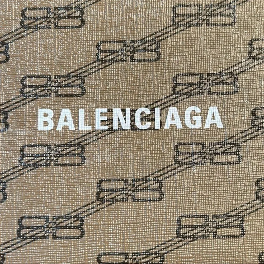 Authentic Balenciaga Signature BB Leather Pouch.